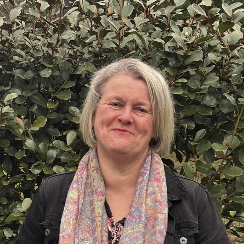 Alison smiling outdoors